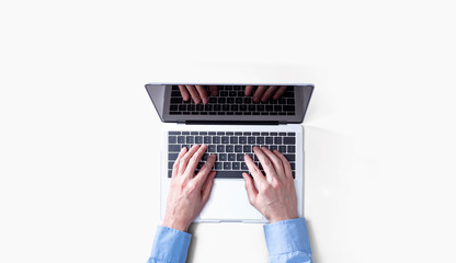 Fototapeta premium Businessman using a laptop computer overhead view