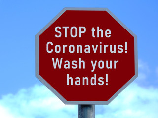 red and white road stop sign design Coronavirus label. importance of handwash to avoid the disease. virus hazard warning, official name COVID-19. illustration style raster image. blue sky background