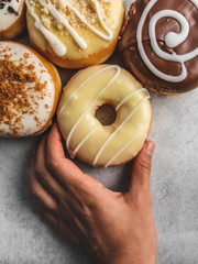 donuts with icing on grey background