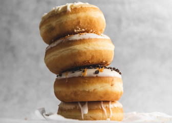 Fototapeta na wymiar stack of donuts on grey background