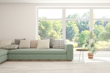 Minimalist living room in white color with sofa and summer landscape in window. Scandinavian interior design. 3D illustration