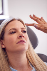 Fototapeta premium Beautician Or Doctor Preparing Female Patient For Anti Ageing Injection