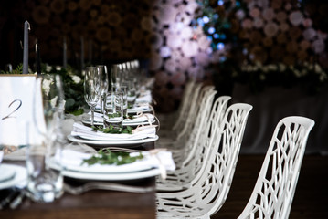 Festive table decorated with flowers and candles