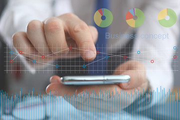 Male hand holding cellphone using some mobile business application