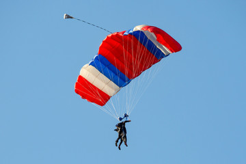 Tandem parachuting.  Tandem skydiving on a large parachute.