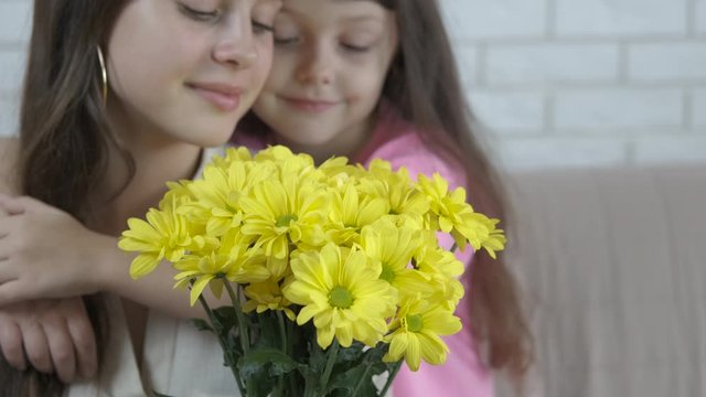 Sisters with flowers.