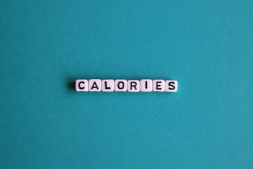 Calories word on green background. Healthy eating concept.