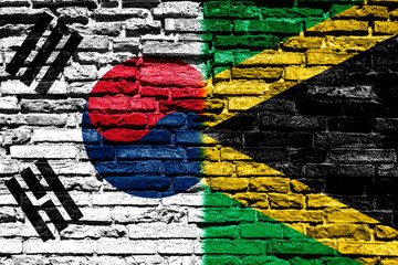 South Korea and Jamaica flag on brick wall