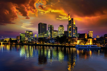 Fototapeta na wymiar The skyline of Frankfurt am Main with flaming red evening sky
