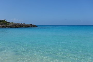 Naklejka na ściany i meble View of a beach on the blue Caribbean Sea in Saint Martin (Sint Maarten), Dutch Antilles