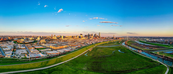 Panoramic aerial drone picture of Dallas skyline and Trammel Crow Park at sunset in winter