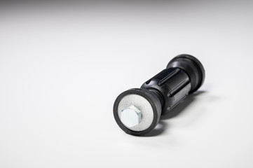 Car front suspension anti-roll bar mount. New tie rod on gray background