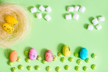 colored eggs, easter concept, green background. Grass paper background. Spring april greeting card.