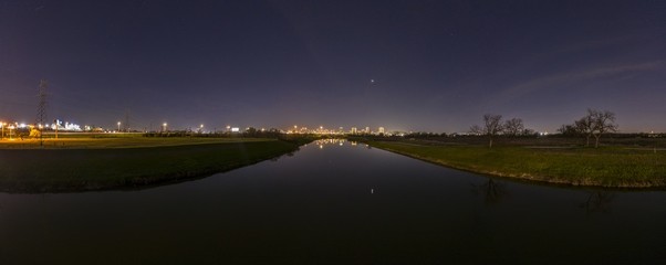 Panoramic aerial view on illuminated skyline of Fort Worth over West Fork Trinity River at night