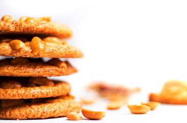 Group of cookies with peanuts on mat.