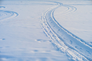 Footprints  in the snow. Sunny winter day. Outdoor activity concept.