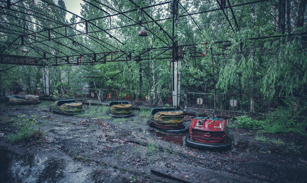 Broken metal radioactive cars in amusement park in Pripyat, the Chernobyl disaster, Ukraine