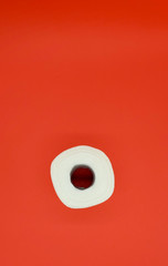Toilet paper on a red background