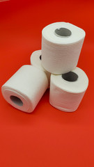 Toilet paper on a red background