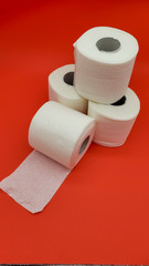 Toilet paper on a red background
