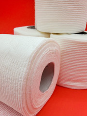 Toilet paper on a red background
