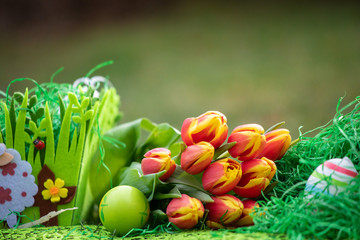 Colorful Easter eggs decorated with flowers in the grass background