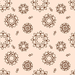 Ethnic brown mandala or snowflakes eamless pattern, background