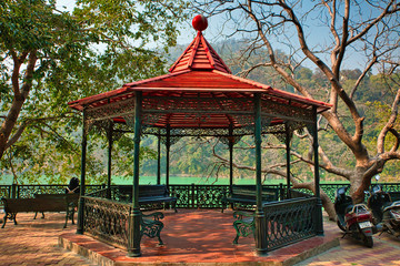View of Ganga river embankment, Lakshman Jhula bridge and Trimbakeshwar Temple in Rishikesh,...