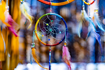 Beautiful colorful dream catcher for sell in souvenir shop on blurred background