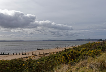 Monifieth Beach with its Wooden Groynes facing out into the Tay estuary on Scotlands East Coast.