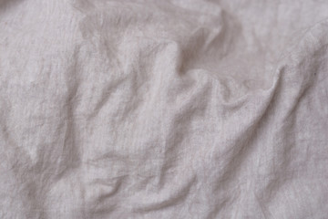 Fototapeta na wymiar Crumpled fabric texture, light cloth background