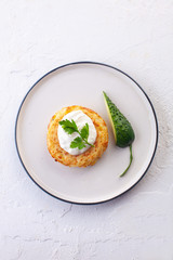 potato pancakes with sour cream , fresh cucumber and herbs