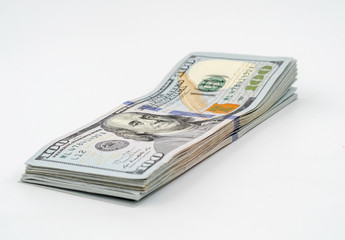 Stack of american dollars. Close-up on white background