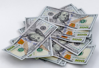 Scattered American dollars. Close-up on white background