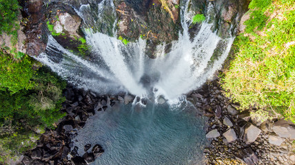 Aerial View of The High Waterfall Jeongbang and Lagoon on Jeju Island