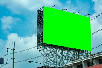 billboard blank and blue sky, copy space on green screen
