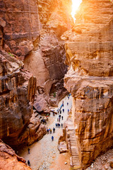Narrow passage full of tourist group on excursion, top view