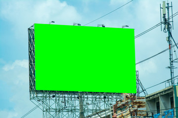 billboard blank and blue sky, copy space on green screen