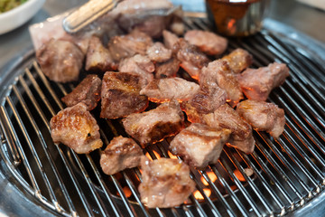 Preparing Traditional Korean Barbecue Grill Pork.