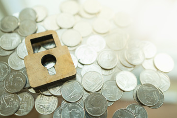 Money, Finance, Retirement and Security Concept. Close up of wooden icon logo master key lock on...