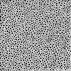 Seamless pattern. Black dots of irregular shape and different sizes isolated on white background. Art texture. Texture for print, wallpaper, home decor, textile, package design