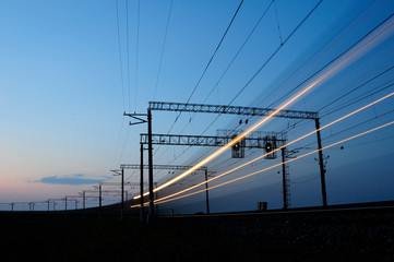 Train travel, railway. Evening. Long exposure.