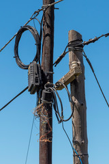 Western Cape, South Africa. Dec 2019. Wires, wiring and junction box on a telegraph pole.