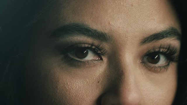 Close Up Slow Motion Clip of woman opening her eyes