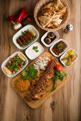 traditional turkish  adana  kebap meal  with garnitures