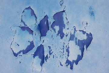 peinture bleue écaillée d'une porte en métal
