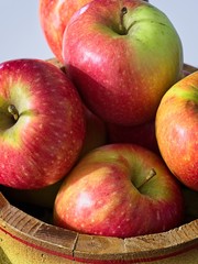 small red apples in basket