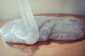glitter slime transparent flexible viscous. game for children. antistress. beautiful background