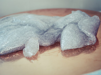 glitter slime transparent flexible viscous. game for children. antistress. beautiful background