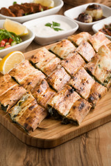 turkish meat pide on wooden table